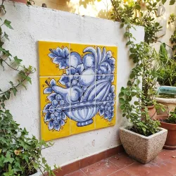 Hand-painted ceramic tile mural for the wall.